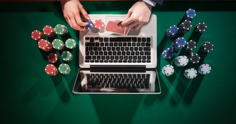 gambling near a laptop picture