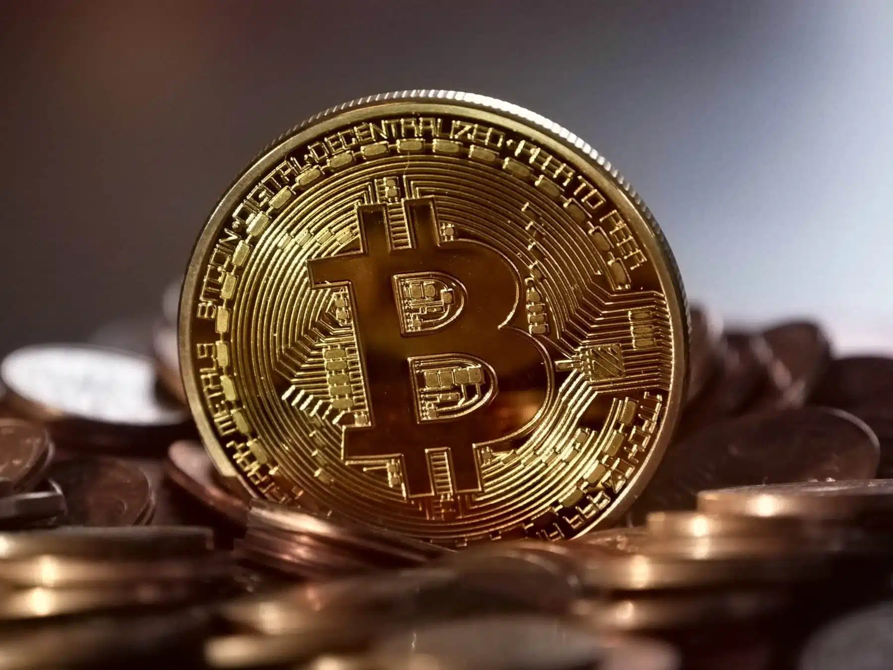 golden bitcoin above pennies