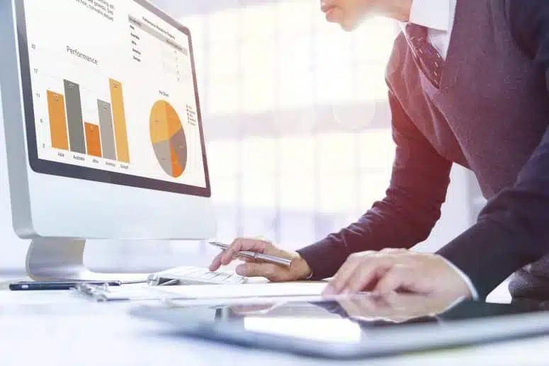 man looking at performance graphs