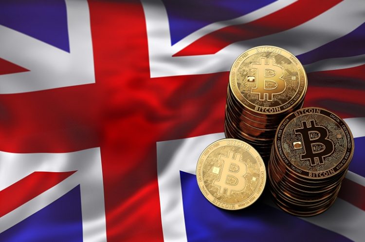 phisycal bitcoins stacked above uk flag UK Post Office