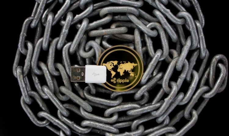 ripple gold coin above a chain
