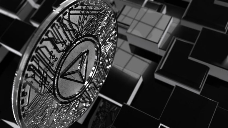tron coin above illustration of blocks