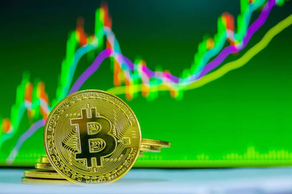 phisycal bitcoin on green background