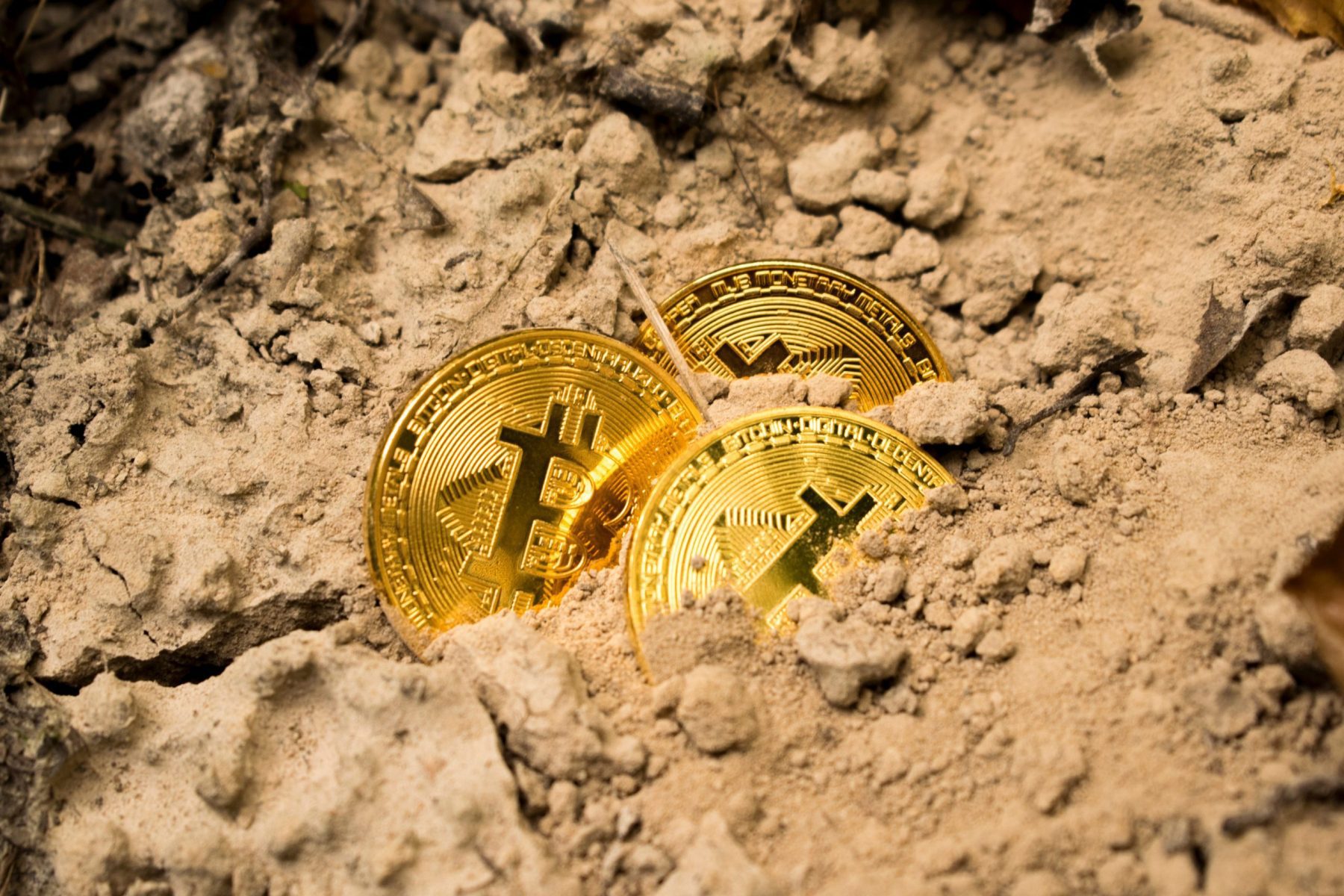 bitcoins buried in sand