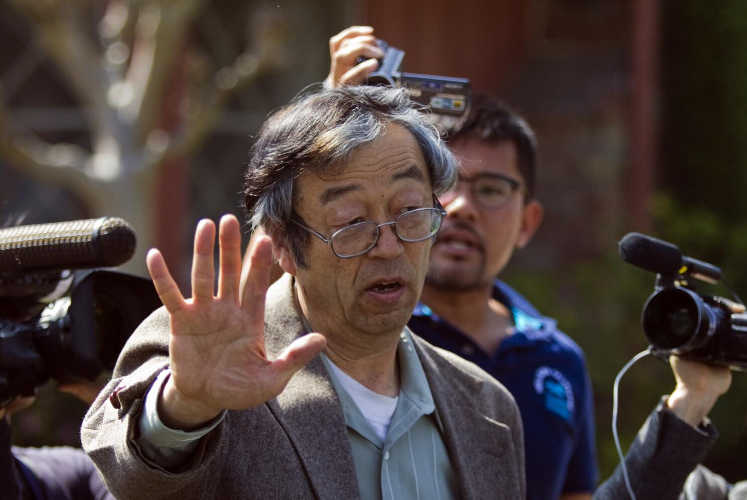 Satoshi Nakamoto: Bitcoin's Creator and the Search for an Identity 5 https://usethebitcoin.com/wp-content/uploads/2026/02/A-hooded-figure-representing-Satoshi-Nakamoto-sits-beside-a-Bitcoin-symbol.jpg UseTheBitcoin image 261